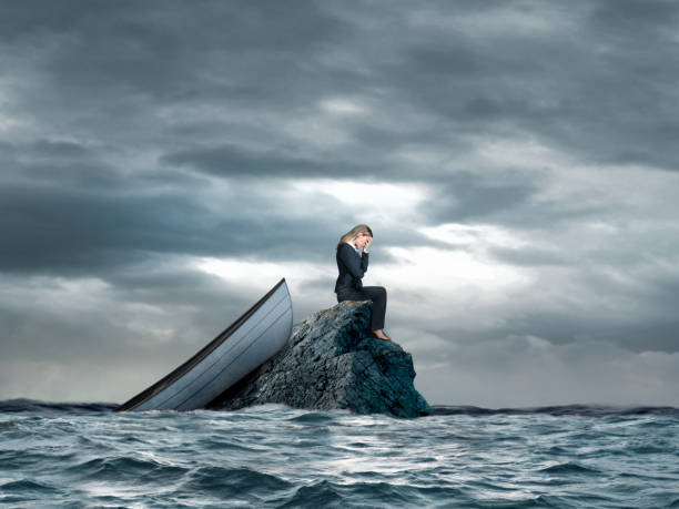 istock Woman Stranded In On Small Rock In The Ocean 2192851726