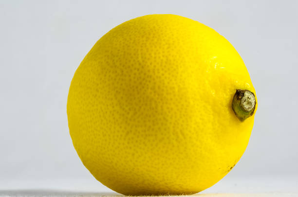 Close-Up Of Lemon Against White Background