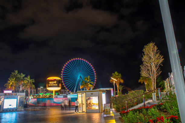 Dubai, United Arab Emirates - December 15, 2024: Bluewaters island in Dubai with Ain Dubai Ferris wheel at night.