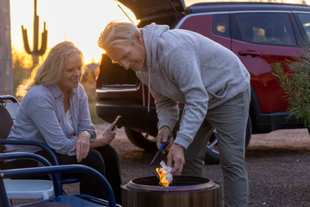 Mature couple enjoy campfire in desert