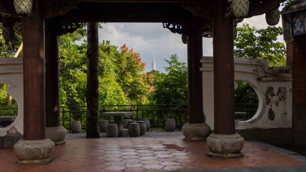 istock Pavilion framing Taipei 101 and lush greenery. 2192852875