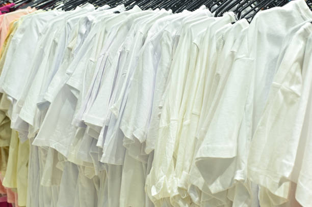 White T-shirts are hanging on hangers
