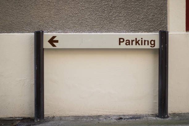 Parking sign with arrow showing left