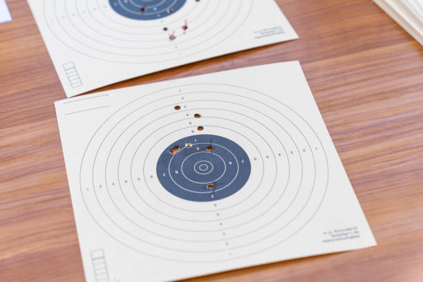 istock Paper shooting targets with bullet holes 2192859768