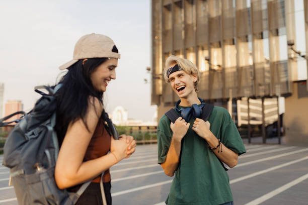 Two Cheerful Friends Sharing a Lighthearted Moment Outdoors During the Day