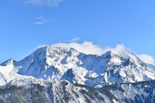 istock French alps on a sunny day under the clouds by winter covered with snow 2192863124