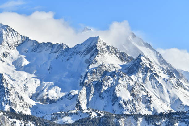 istock French alps on a sunny day under the clouds by winter covered with snow 2192863128