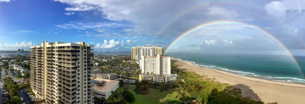 istock Beautiful double rainbow over North Palm Beach with clouds in the sky 2192865592