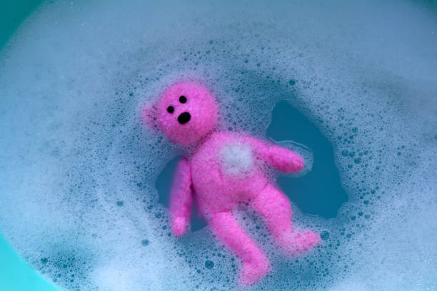 istock Soak the teddy bear in water soluble laundry detergent. 2192869519