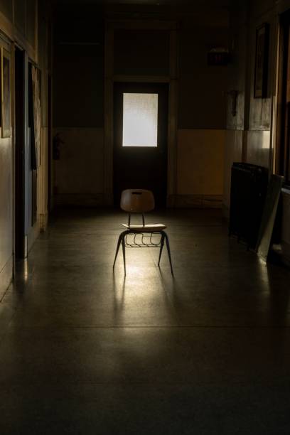 istock Solitary chair in hallway with window 2192869712
