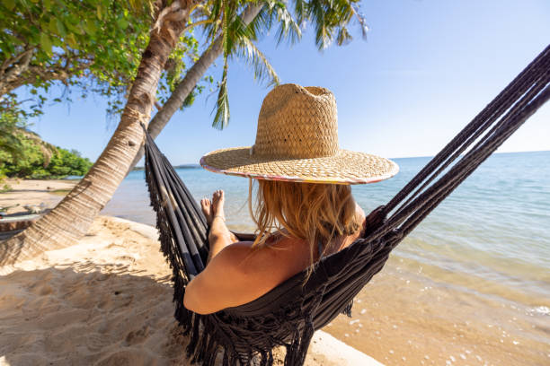 istock Woman Relaxing in Hammock on Tropical Beach 2192871721