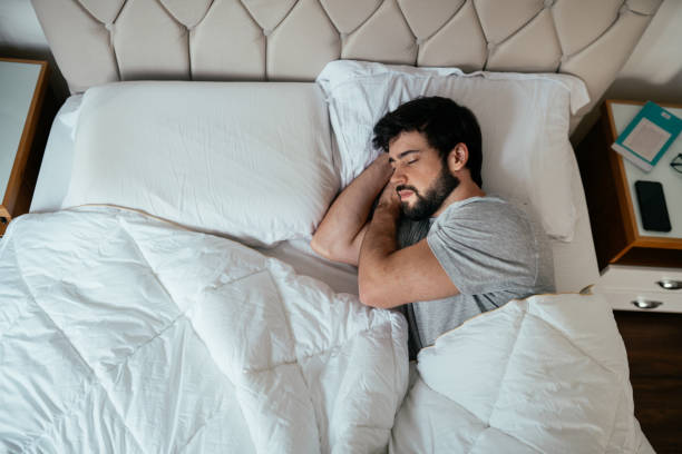 istock Side view of  Hispanic Brazilian bearded man sleeping on his bed 2192871761