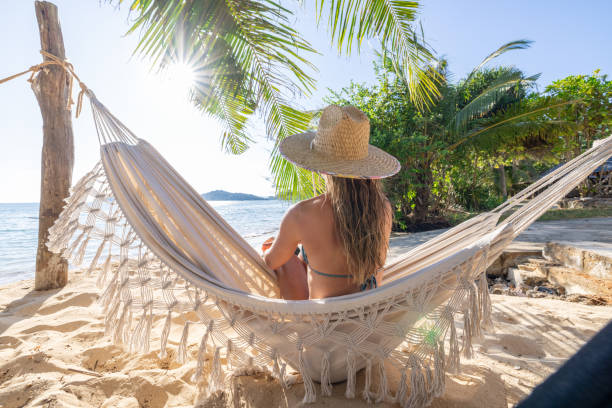 istock Woman Relaxing in Hammock on Tropical Beach 2192871813