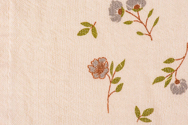 Light beige fabric with blue flowers on it as a background