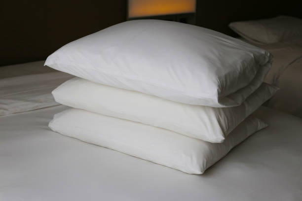 istock Bed with pillows in bedroom hotel 2192873547