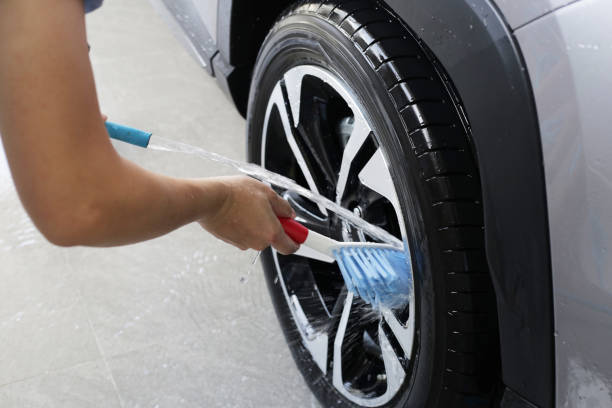 istock Washing car, cleaning tires and wheels 2192873738