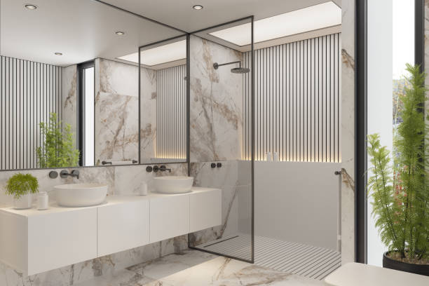 istock Modern Minimalist White Master Bathroom Interior with Double Sinks and Shower with large marble tiles and plants 2192874527