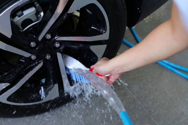istock Washing car, cleaning tires and wheels 2192874547