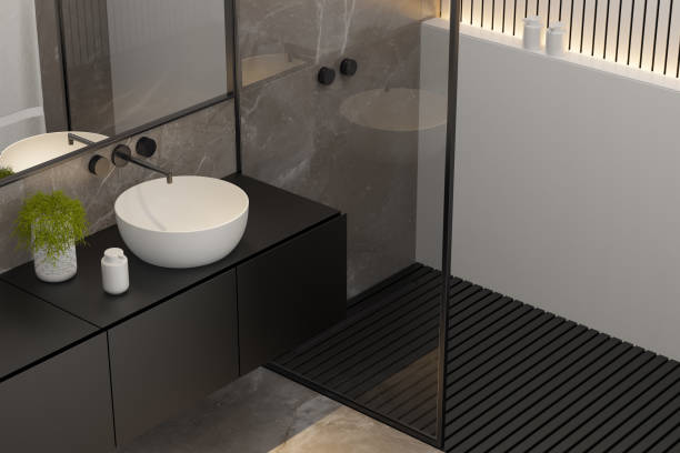 istock Modern Minimalist Master Bathroom Interior with Double Sinks and Shower with large marble tiles and plants. Black furniture cabinets. 2192874599