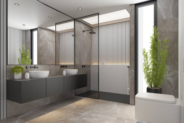 istock Modern Minimalist Master Bathroom Interior with Double Sinks and Shower with large marble tiles and plants. Black furniture cabinets. 2192874682