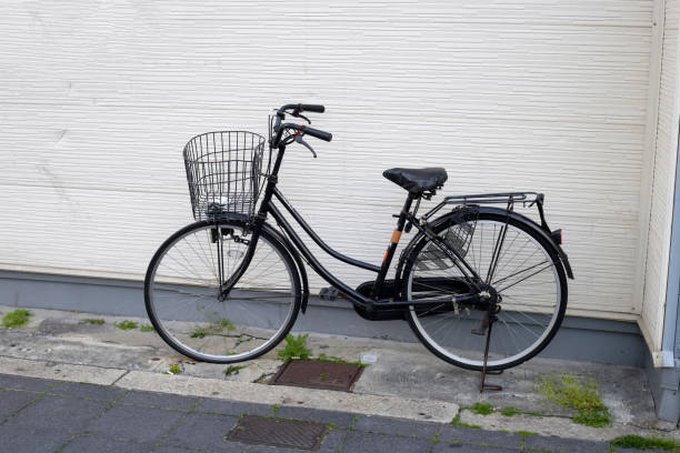 istock Bicycle lined up in a row on the sidewalk. 2192875444