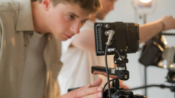 istock Videographer work cameraman look man digital film 2192876038