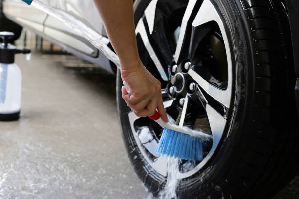 istock Washing car, cleaning tires and wheels 2192876889