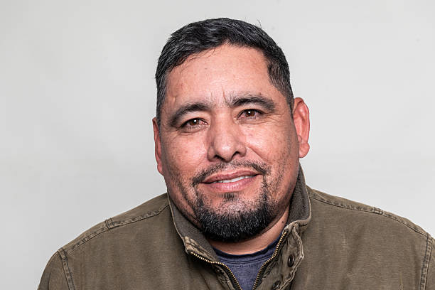 istock Smiling hispanic mature man headshot on gray background 2192879025