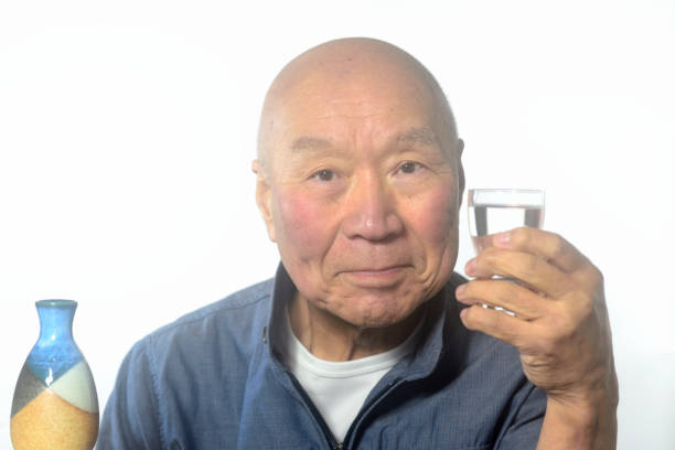 istock An old man enjoying a glass of sake 2192879255
