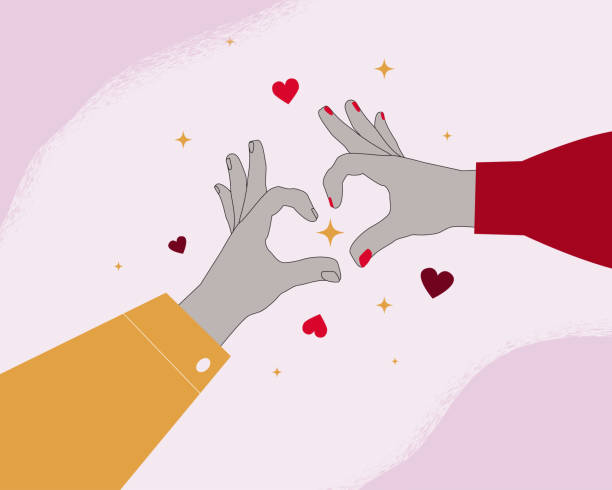 istock The two hands reach out to each other, forming a heart shape with their fingers. A symbol of love, connection and togetherness. Perfect for Valentine's Day design, wedding invitations or any other project, romantic cards. 2192882517