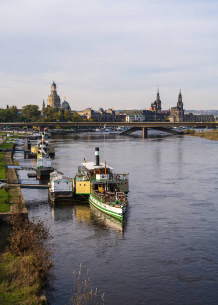 Dresden, Saxony, Germany. 19.10.2024. Landscape of beautiful tourist city of Dresden. On river Elbe tourist ships moored on shore. Cityscape. Old architecture.