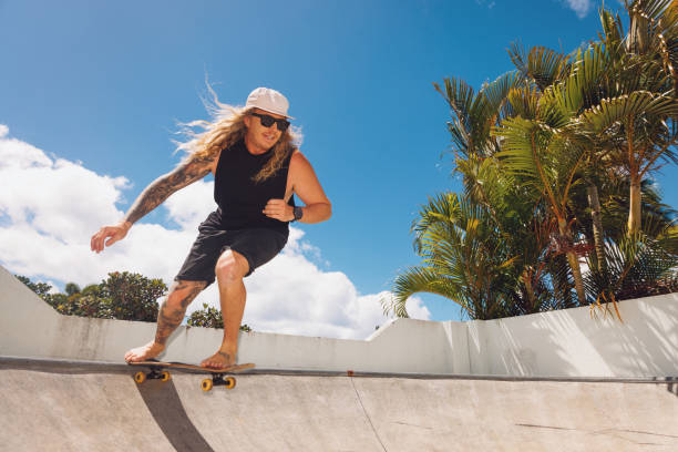 Skateboarding Dad showing off in his backyard skate ramp