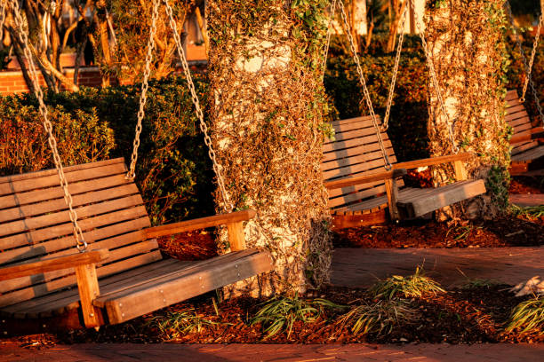 Three wooden swings in an urban park in Beaufort, South Carolina, United States