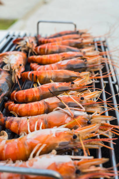 istock Fresh river prawns grilled over charcoal fire. 2192894390