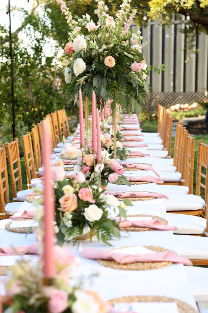 istock Elegant Outdoor Wedding Table Setting with Floral Arrangements 2192895185