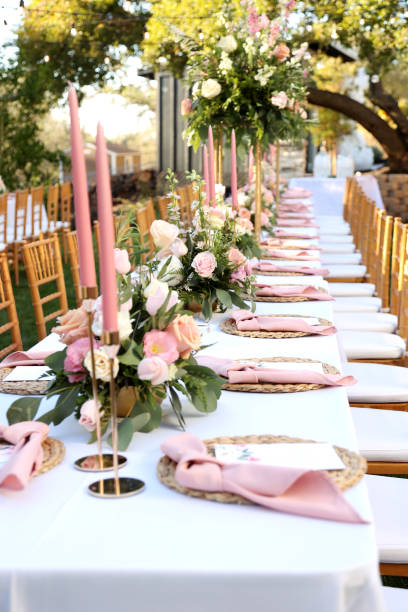 istock Romantic Outdoor Wedding Reception Table with Pastel Florals and Candles 2192895234