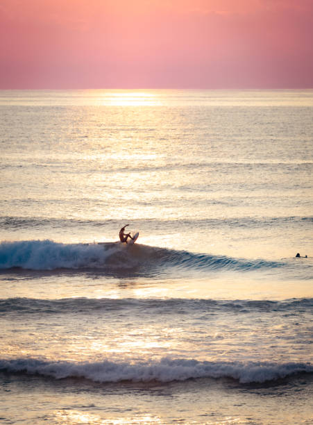 Uluwatu beach is the most popular surfing center in Bali island, Indonesia.