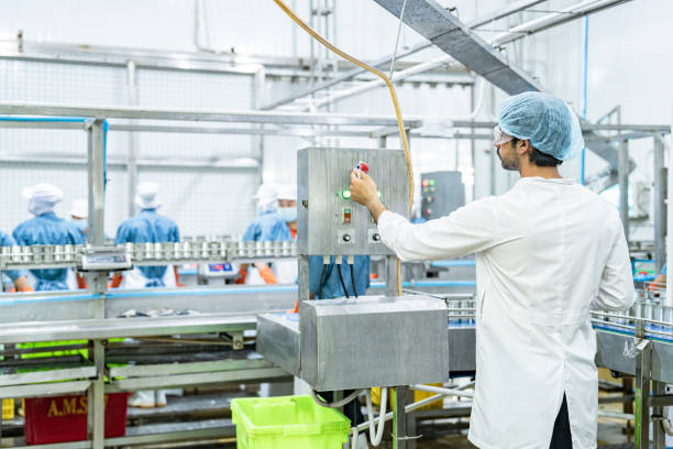 istock scientist food processing plant supervisor examines industrial control systems, overseeing the production line to maintain high-quality standards and optimize the automated manufacturing process. 2192901983
