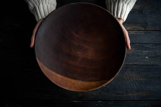 Woman holding a  plate with copy space
