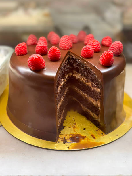 istock Image of delectable chocolate raspberry gateau sliced with butter icing, cream frosting, bakery-fresh finish 2192904708