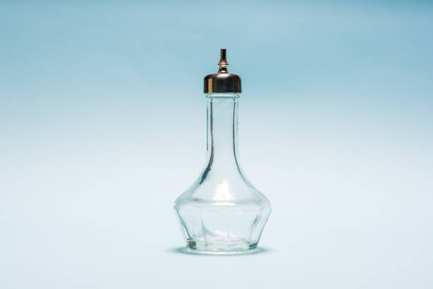 istock Empty crystal bitters bottle or bartender medicine bottle on blue background 2192907809