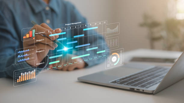 istock Project management concept. Site manager working with Gantt chart schedule to plan tasks and progress. Planning software. Corporate strategy for construction, finance, operations, sales, marketing. 2192908515