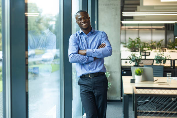istock Young handsome african businessman smiling in an office environment 2192909534