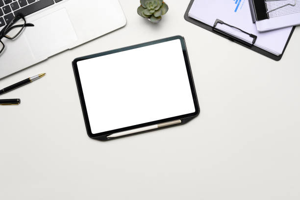istock Modern workspace with digital tablet, laptop, glasses and office supplies 2192911011
