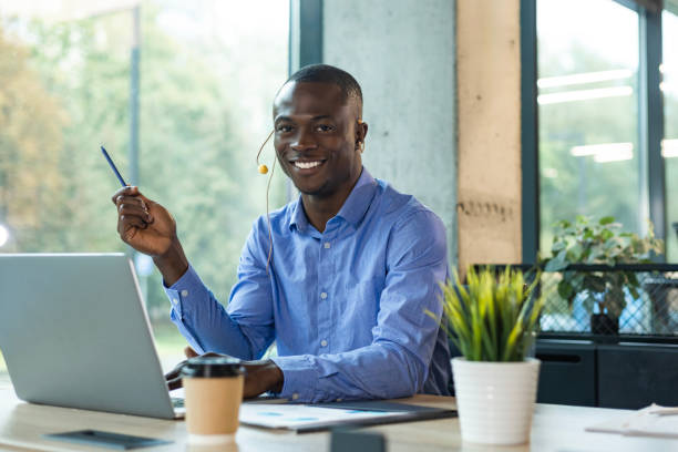 istock Happy young african male customer support executive working in office. 2192911473