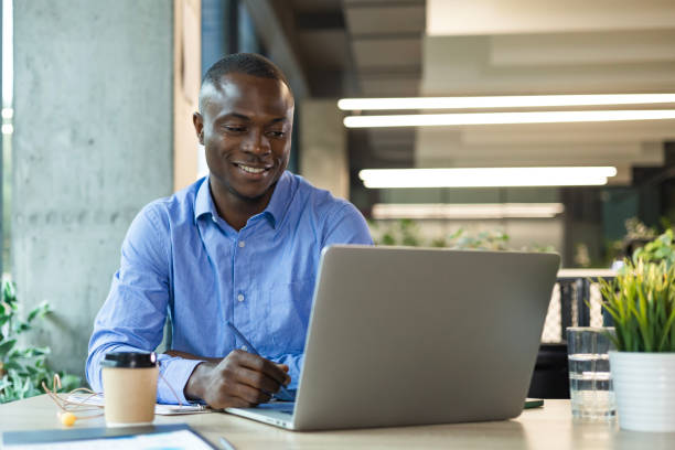 istock Smiling friendly handsome male call center operator working on hot line with clients 2192911513