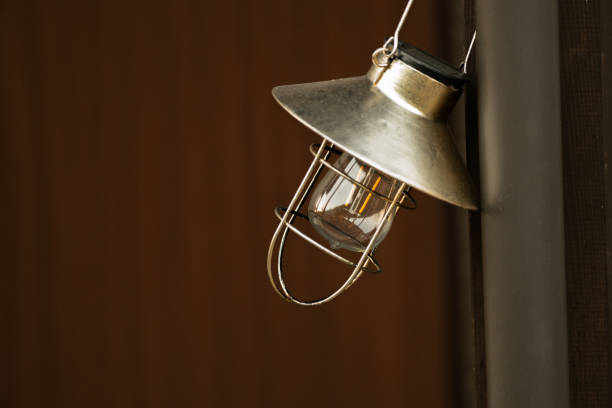 istock Retro style light bulbs hanging on the wall 2192915937