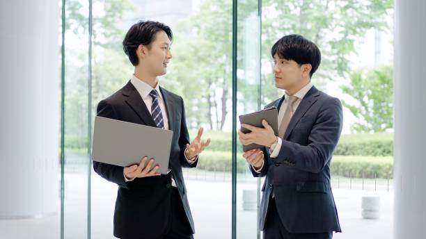 istock Businessmen having a meeting in the lobby 2192916759