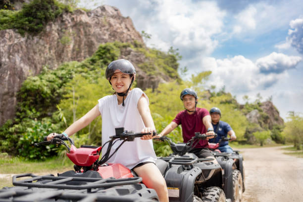 Couple riding ATV outdoor