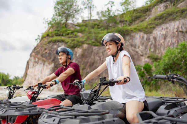 istock Couple riding ATV outdoor 2192916997